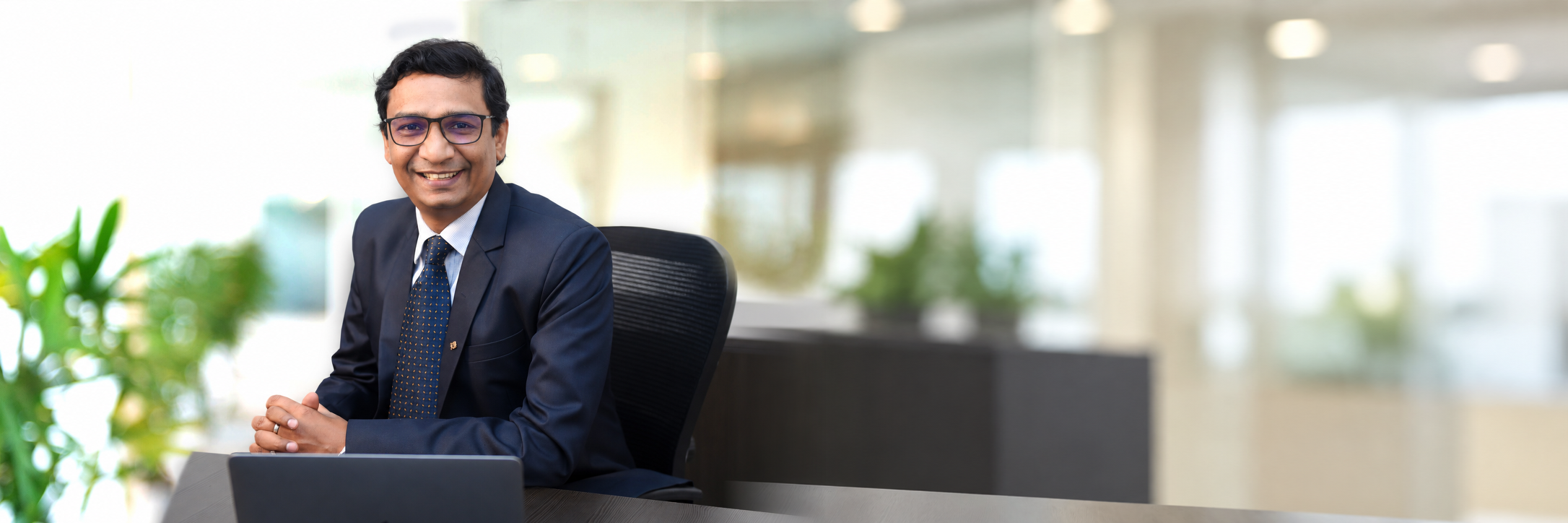 Nishat Goyal seated in his office